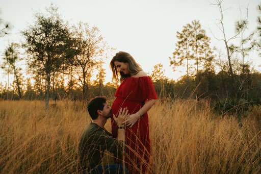 Maternity portrait in red dress